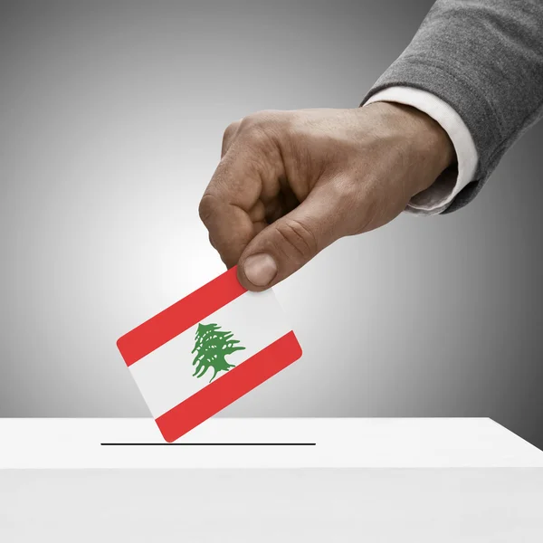 Black male holding flag. Voting concept - Lebanon — Stock Photo, Image