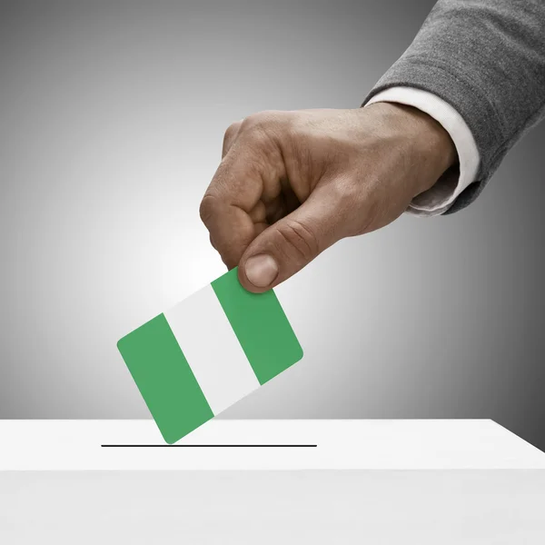 Black male holding flag. Voting concept - Nigeria — Stok Foto