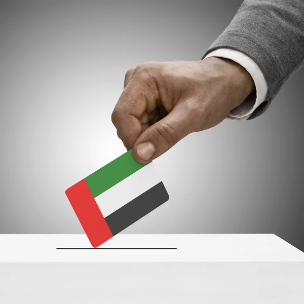 Black male holding flag. Voting concept - United Arab Emirates — Stock Photo, Image