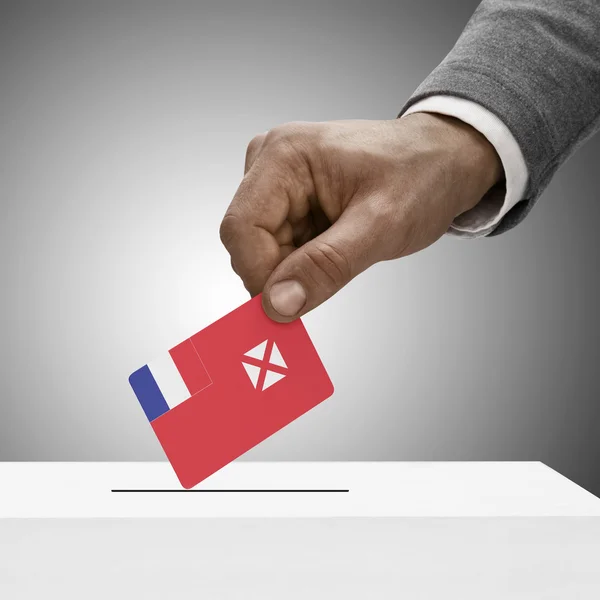 Black male holding flag. Voting concept - Wallis and Futuna — Stock Photo, Image
