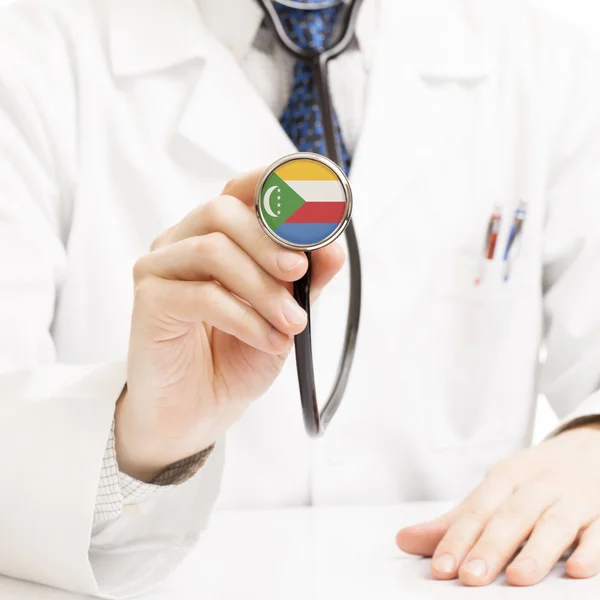 Doctor holding stethoscope with flag series - Comoros — Stock Photo, Image