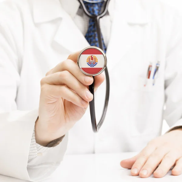 Doctor holding stethoscope with flag series - French Polynesia — Stock Photo, Image