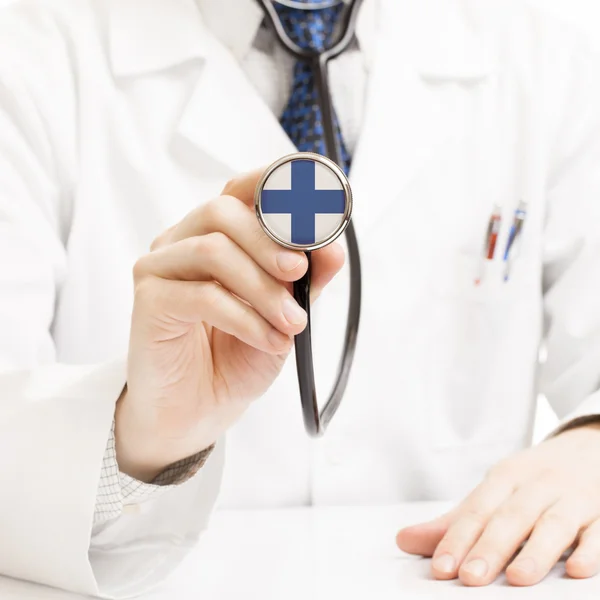 Doctor holding stethoscope with flag series - Finland — Stock Photo, Image