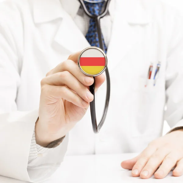Läkare anläggning stetoskop med flagg-serien - Sydossetien — Stockfoto
