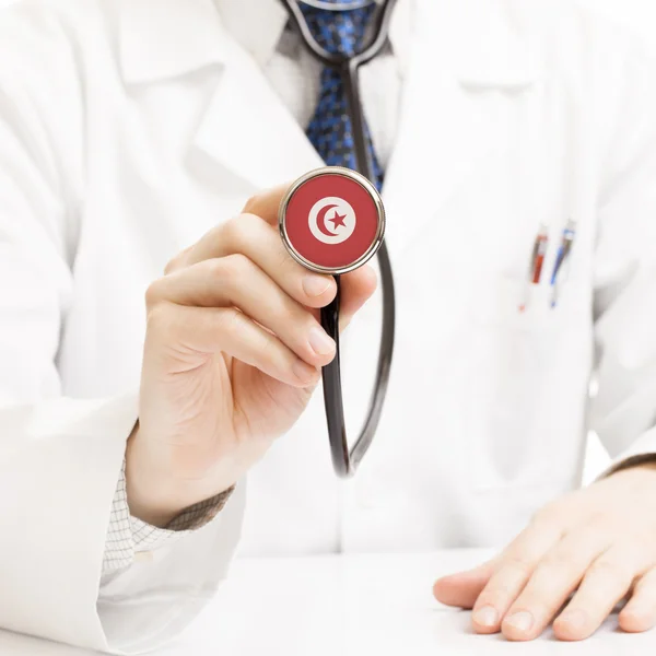 Doctor holding stethoscope with flag series - Tunisia — Stock Photo, Image