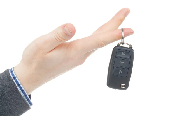 Male hand giving car keys - studio shot isolated on white — Stock Photo, Image