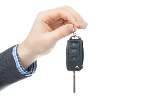 Male hand giving car keys - studio shot isolated on white background — Stock Photo, Image