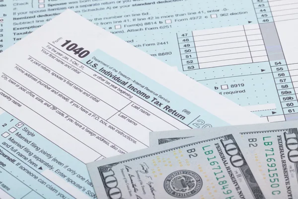 US Tax Form and dollars - studio shot — Stock Photo, Image