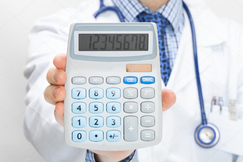 Doctor holding calculator in hand - health care concept