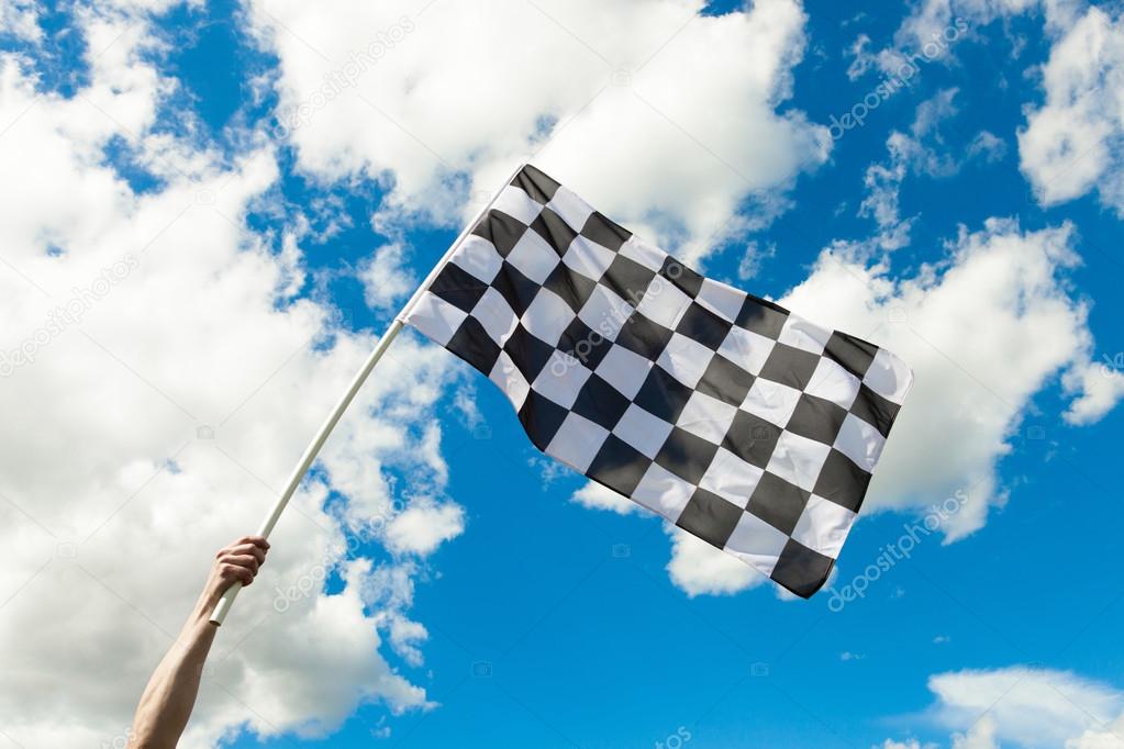 Checkered flag waving in the wind - outdoors shoot