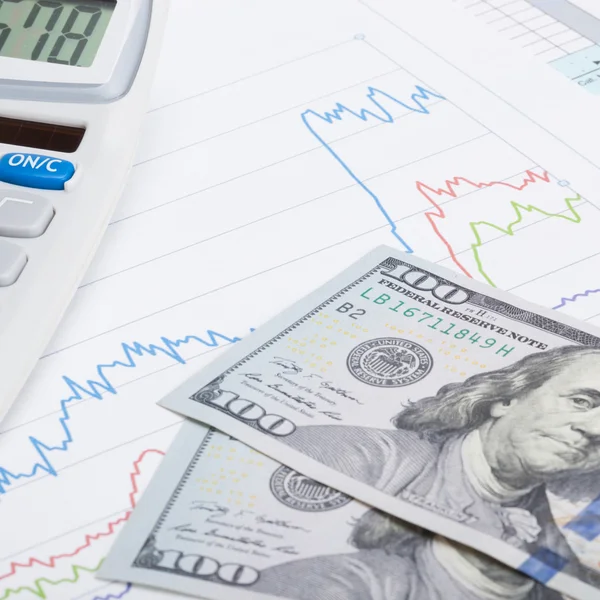 Stock market graph with calculator and 100 dollars banknote - st — Stock Photo, Image