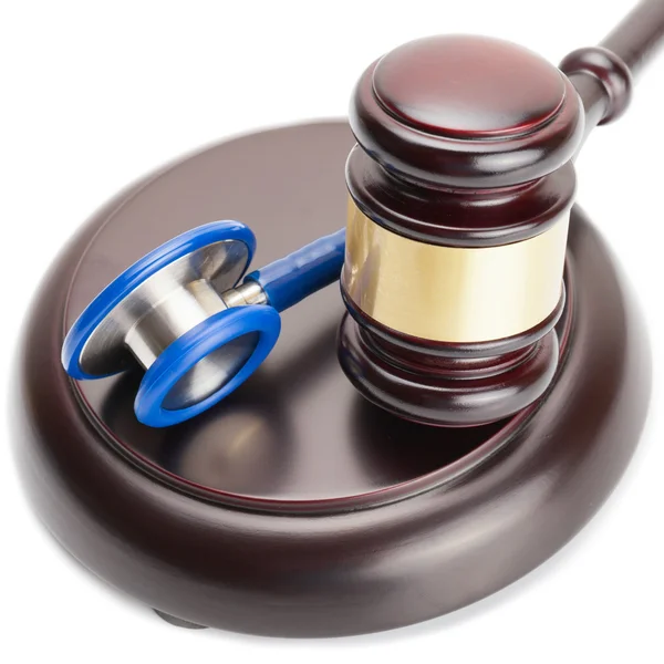 Judge gavel and stethoscope near it - close up shot — Stock Photo, Image