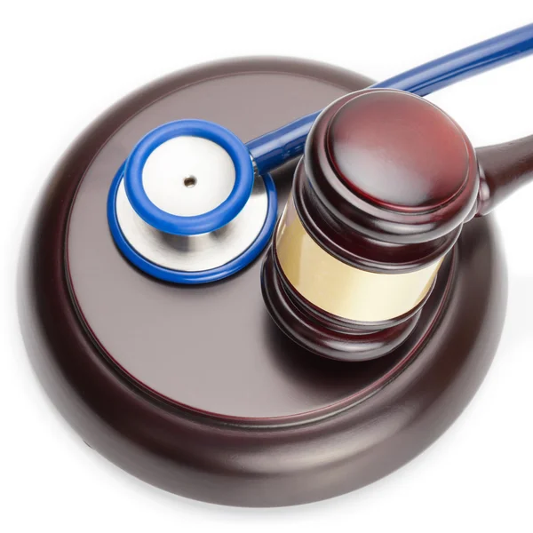 Judge gavel and stethoscope on white - close up shot — Stock Photo, Image