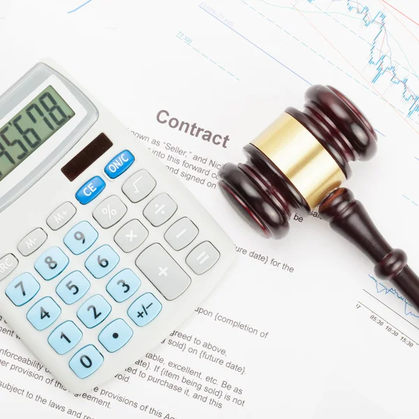 Wooden judge's gavel and calculator over contract - close up shot — Stock Photo, Image