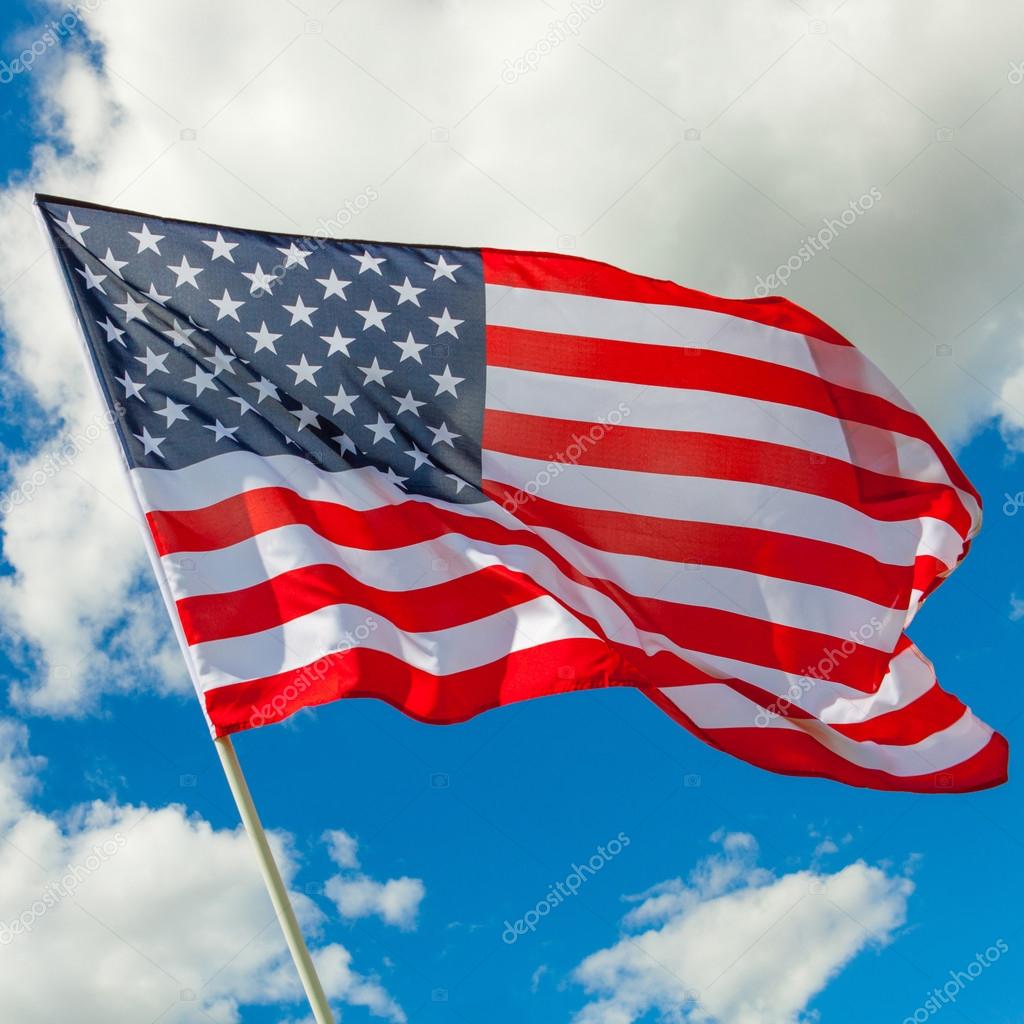 Neat USA flag and cumulus clouds behind it