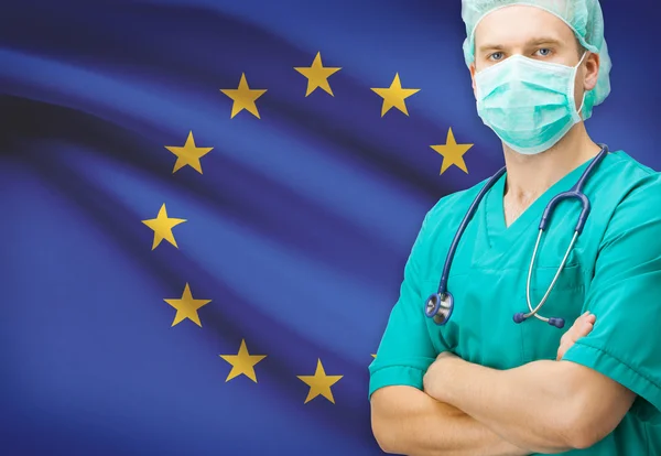 Хирург с национальным флагом на фоне серии - Европейский союз — стоковое фото
