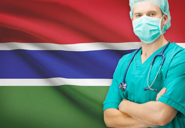 Cirurgião, com a bandeira nacional na série de fundo - Gâmbia — Fotografia de Stock