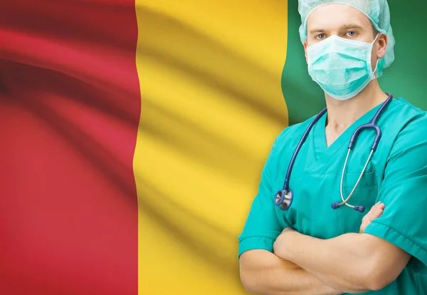 Surgeon with national flag on background series - Guinea — Stock Photo, Image