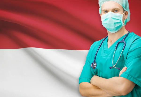 Хирург с национальным флагом на фоне серии - Индонезия — стоковое фото