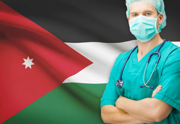 Хирург с национальным флагом на фоне серии - Jordan — стоковое фото