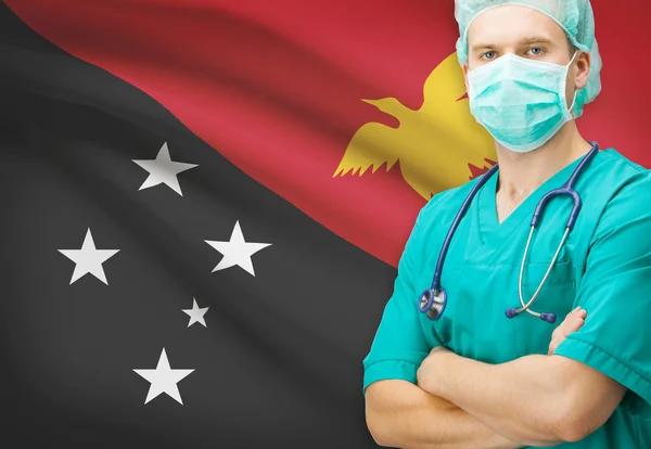 Cirurgião, com a bandeira nacional na série de fundo - Papua-Nova Guiné — Fotografia de Stock