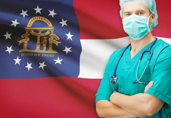 Chirurg s námi státní vlajky na pozadí řady - Georgia — Stock fotografie