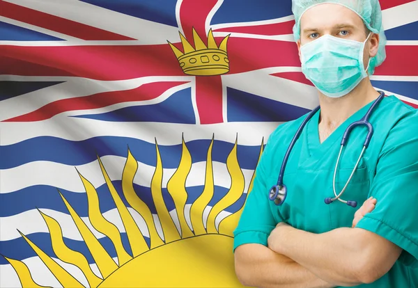 Kirurg med kanadensiska privinces flagga på bakgrunden serien - British Columbia — Stockfoto