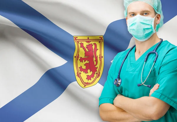 Chirurg z privinces kanadyjskiej flagi na tle serii - Nova Scotia — Zdjęcie stockowe