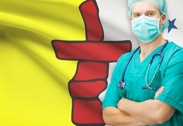 Chirurg met Canadese privinces vlag op achtergrond serie - Nunavut — Stockfoto