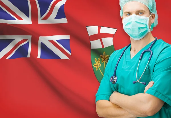 Chirurg z privinces kanadyjskiej flagi na tle serii - Ontario — Zdjęcie stockowe