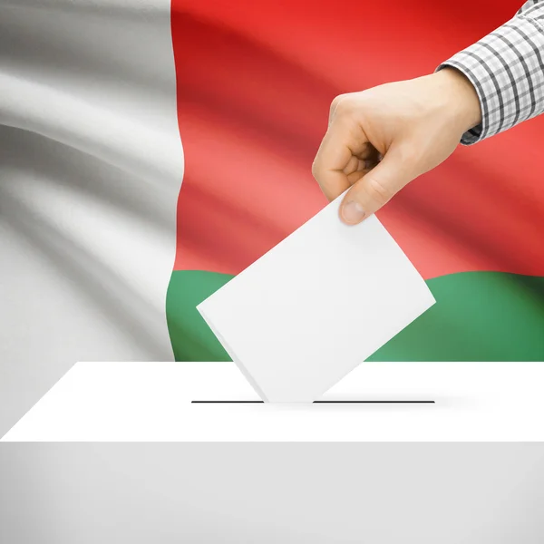 Ballot box with national flag on background - Madagascar — Stock Photo, Image