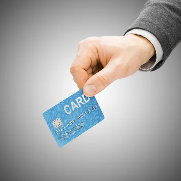 Mão masculina com cartão de crédito - conceito a pagar — Fotografia de Stock