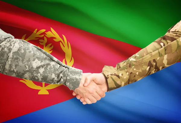 Men in uniform shaking hands with flag on background - Eritrea — Stock Photo, Image