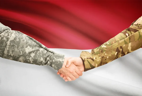 Arka plan - Endonezya bayrağı elini sıkarken üniformalı erkekler — Stok fotoğraf