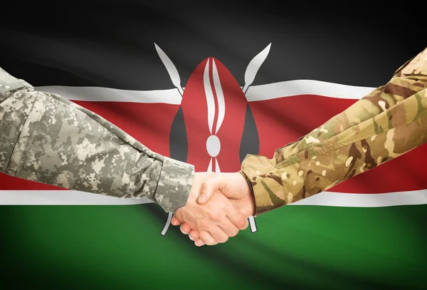 Men in uniform shaking hands with flag on background - Kenya — Stock Photo, Image