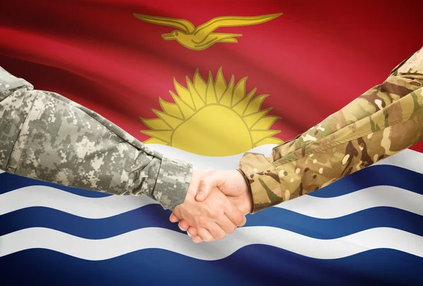 Men in uniform shaking hands with flag on background - Kiribati — Stock Photo, Image