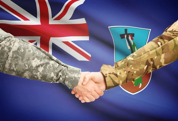 Men in uniform shaking hands with flag on background - Montserrat — Stock Photo, Image