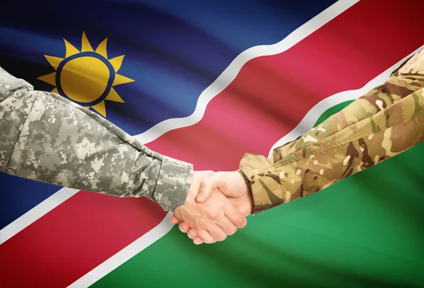 Hombres en uniforme, agitando las manos con la bandera sobre fondo - Namibia — Foto de Stock