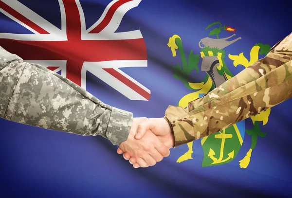 Men in uniform shaking hands with flag on background - Pitcairn Island — Stock Photo, Image
