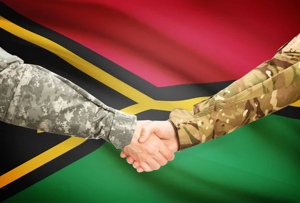 Men in uniform shaking hands with flag on background - Vanuatu — Stock Photo, Image