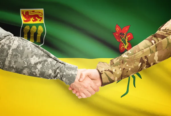 Military handshake and Canadian province flag - Saskatchewan — Stock Photo, Image