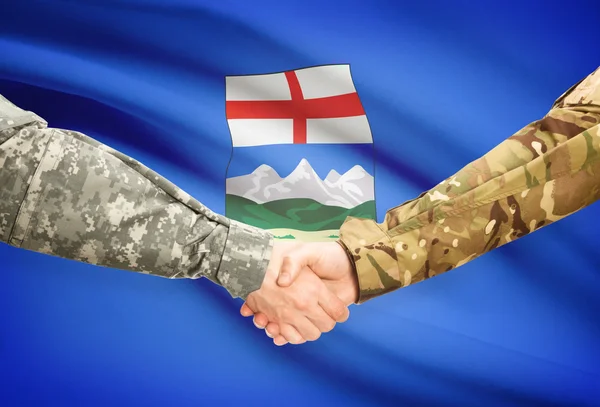 Vojenské handshake a kanadské provincie vlajky - Alberta — Stock fotografie