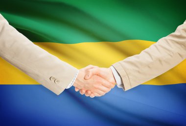 Arka plan - Gabon bayrağı ile işadamları el sıkışma