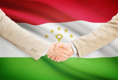 Arka plan - Tacikistan bayrağı ile işadamları el sıkışma