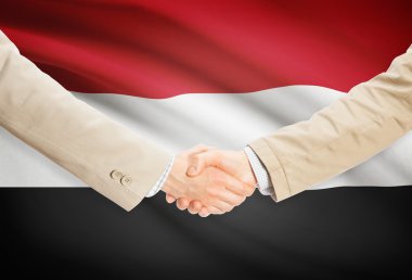 Arka plan - Yemen bayrağı ile işadamları el sıkışma