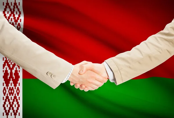 Businessmen handshake with flag on background - Belarus — Stock Photo, Image