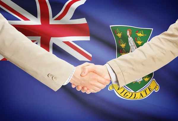 Üzletemberek kézfogás zászló a háttérben - Brit Virgin-szigetek — Stock Fotó