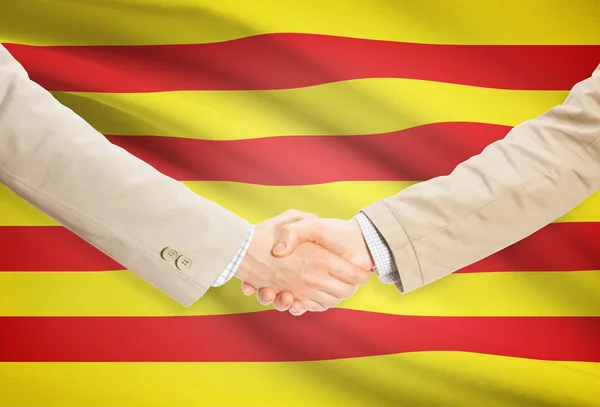 Businessmen handshake with flag on background - Catalonia - Spain — Stock Photo, Image