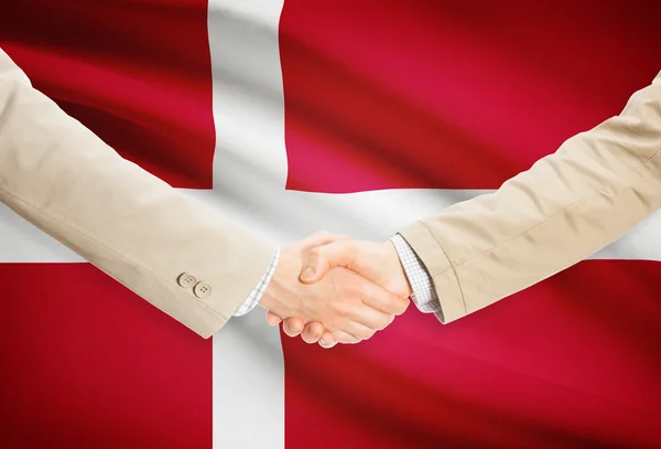 Businessmen handshake with flag on background - Denmark — Stock Photo, Image