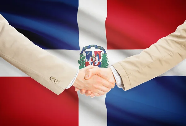 Businessmen handshake with flag on background - Dominican Republic — Stock Photo, Image